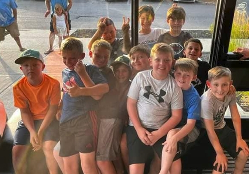 group of kids smiling at the camera